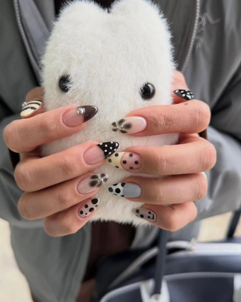 Black and white cow print and polka dot nail art